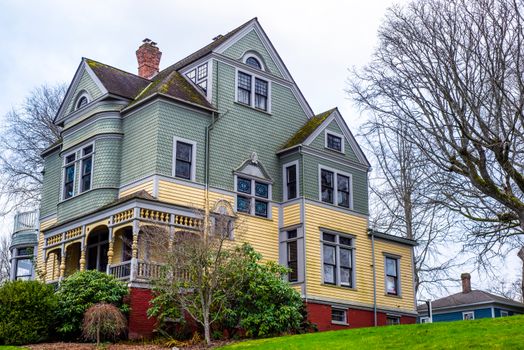 Beautiful Victorian house with intricate facade on a bright spring day.