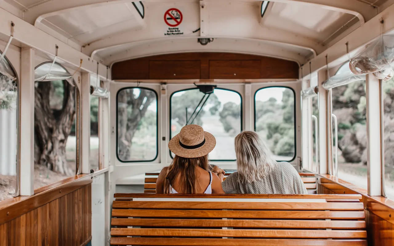 Visitors enjoying a scenic tram journey