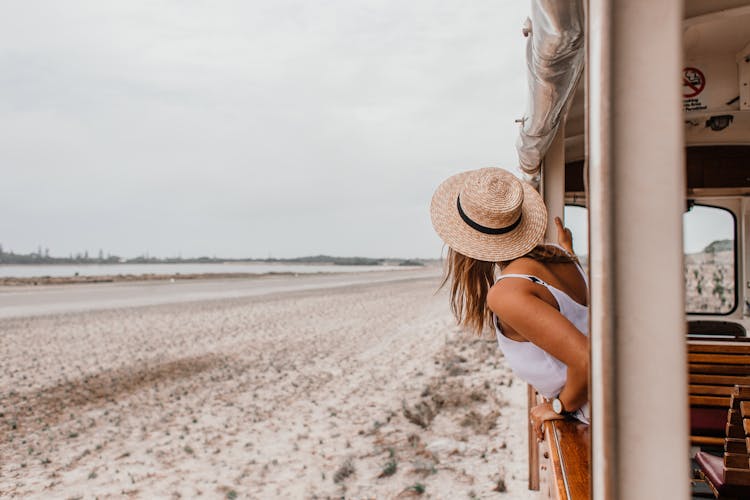 A Woman Leaning Out Of A Window Train