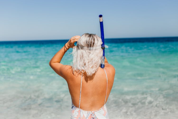 A Person Holding A Snorkel