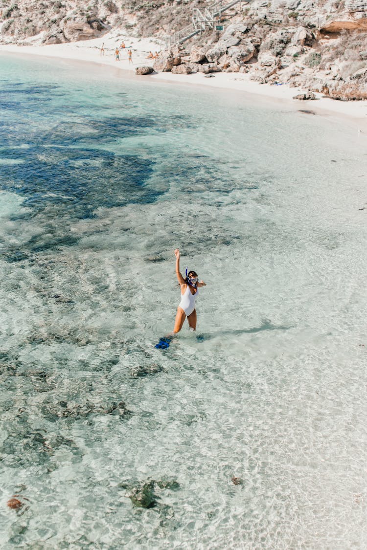 Drone Shot Of Woman In Shallow Water