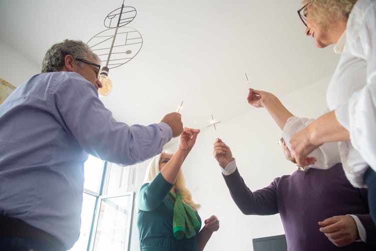 Elderly Friends Holding Sparklers