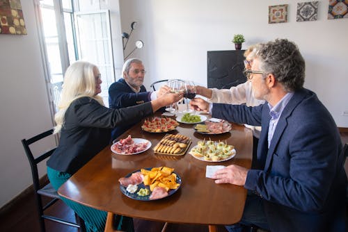 Free Toast at Dinner of Elegant People Stock Photo