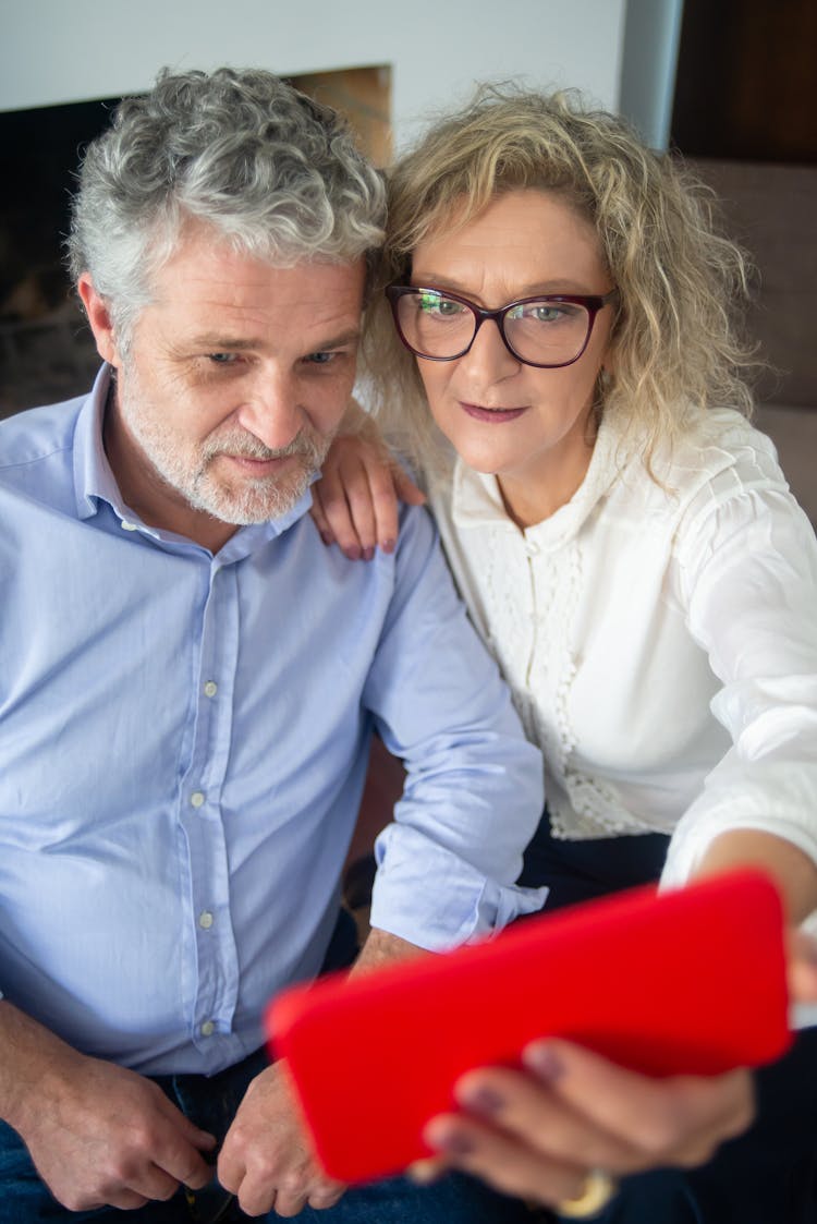 An Elderly Couple On A Video Call On A Smartphone