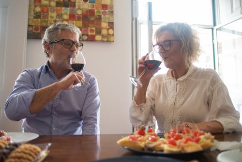 Free A Couple Sitting at the Table Stock Photo