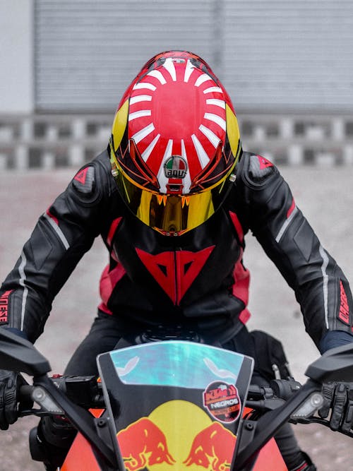 Free Man in a Helmet on a Motorbike Stock Photo