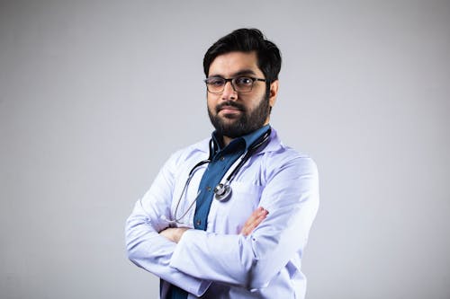 Free A Man in White Coat with Stethoscope Stock Photo