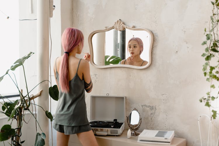 A Girl Looking At The Mirror