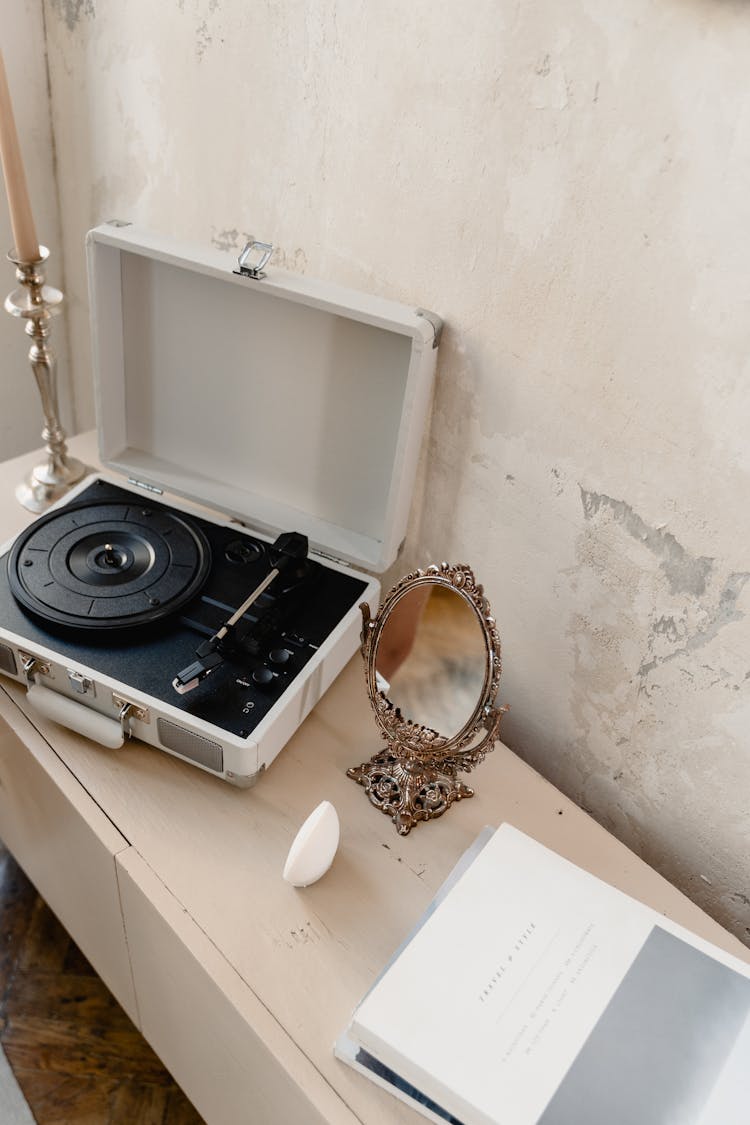 A Vanity Mirror Beside A Record Player