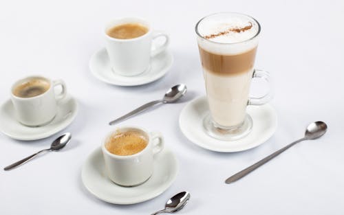 Latte on Glass Cup and Espresso on Ceramic Cups