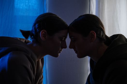 Man in Black Shirt Kissing Woman in White Sweater