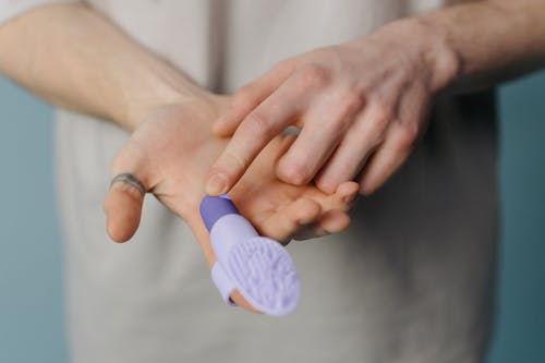 Free Person Holding a Finger Vibrator  Stock Photo