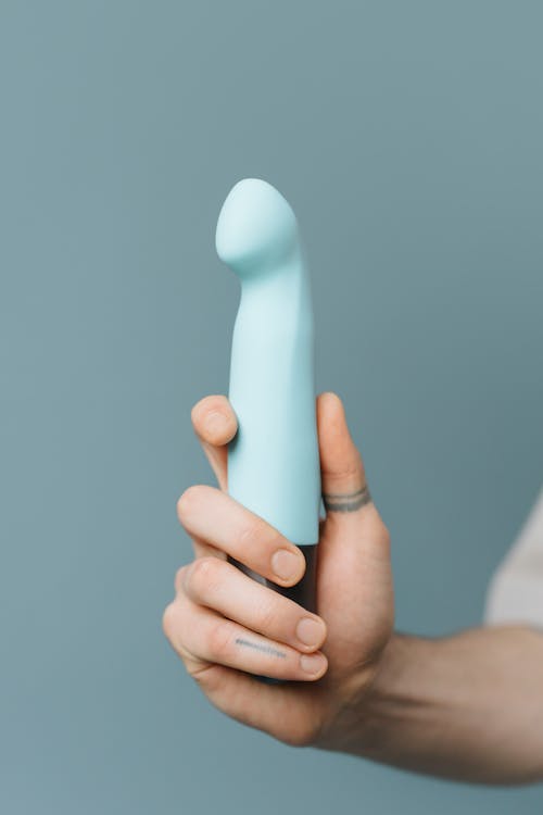 Základová fotografie zdarma na téma detail, dildo, držení