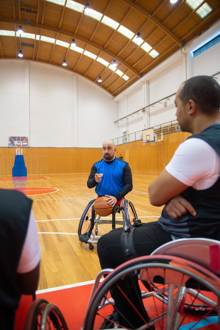 Men On Wheelchairs Playing Basketball