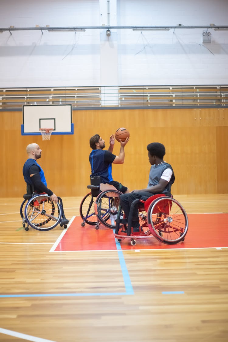 Men On Wheelchairs Playing Basketball