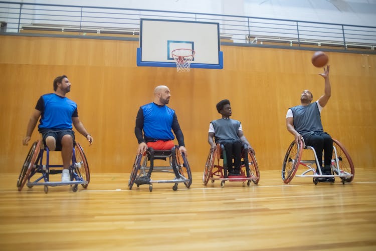 Men On Wheelchairs Playing Basketball