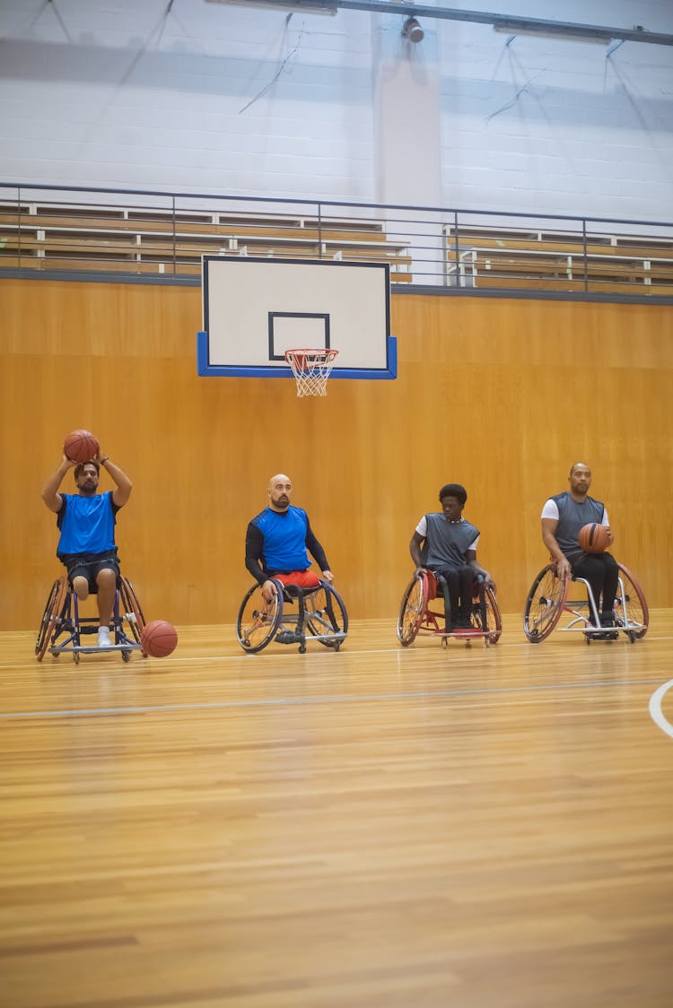 Men On Wheelchairs Playing Basketball