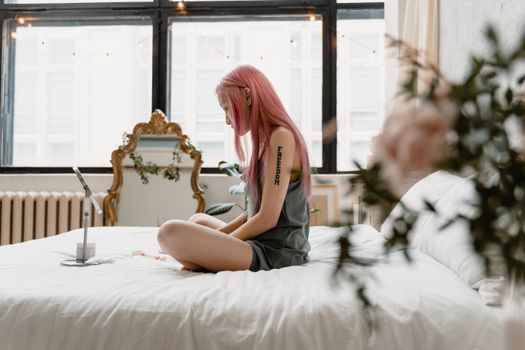 A Woman Sitting on the Bed