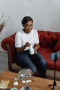 Woman Filming a Product Review Video