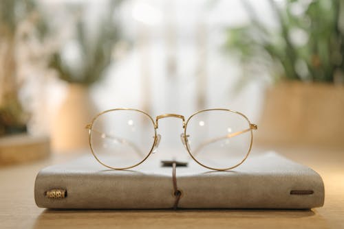Close Up Shot of Gold Framed Eyeglasses