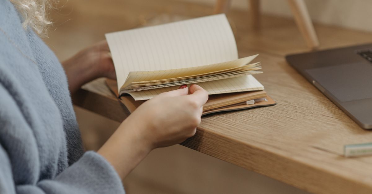 person journaling in morning light, peaceful sleep routine