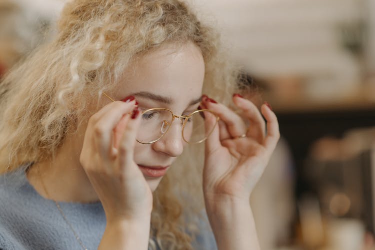 Beautiful Woman Wearing Gold Eyeglasses