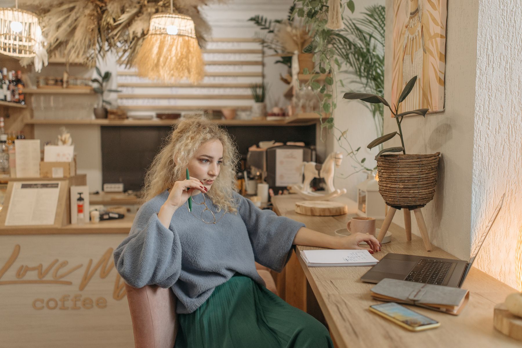 Photo by Pavel Danilyuk on Pexels — a person working at a laptop in a warm, wood-panelled room