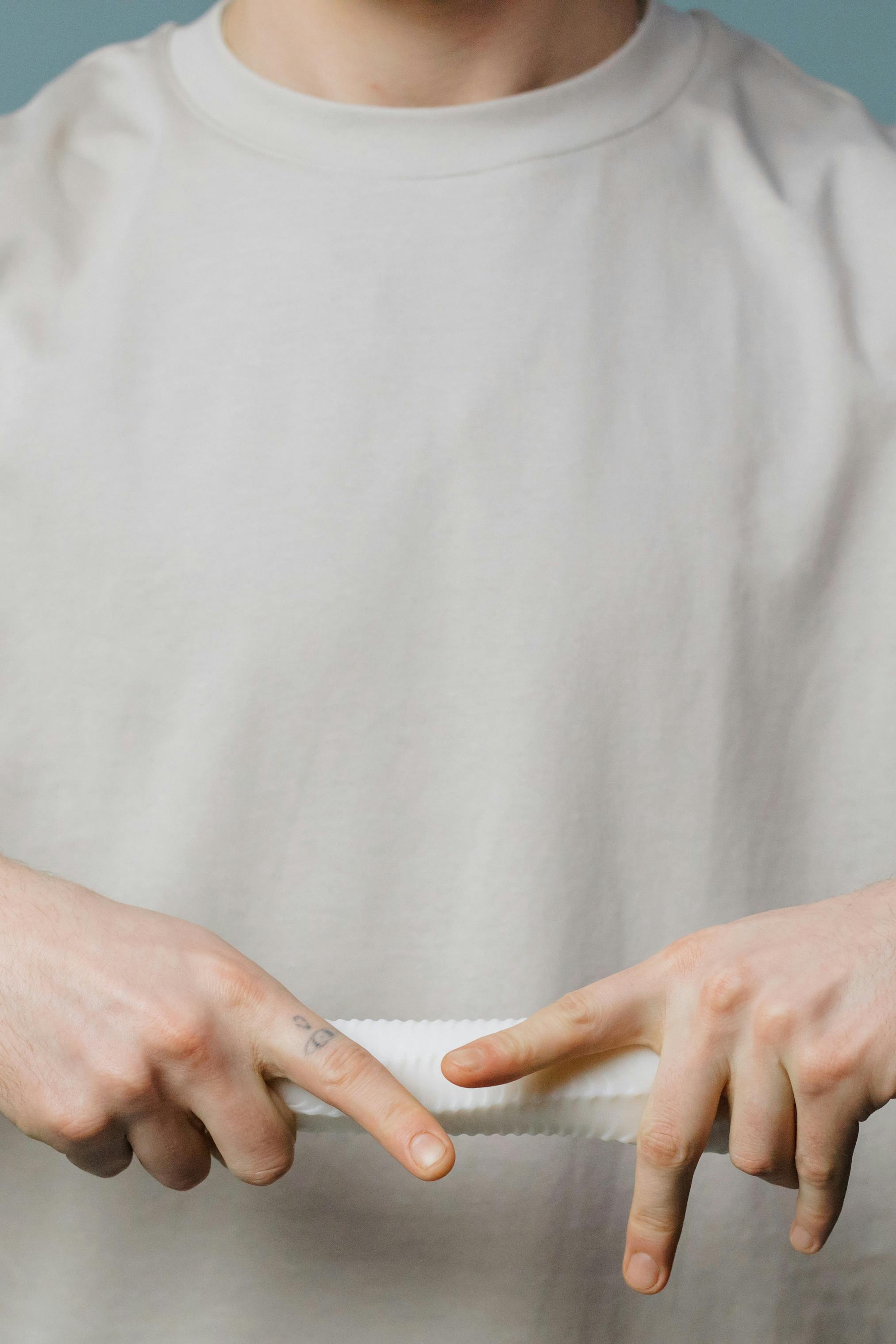 close up shot of a person holding a sex toy