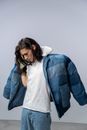 Woman in Blue Denim Jacket and White Shirt