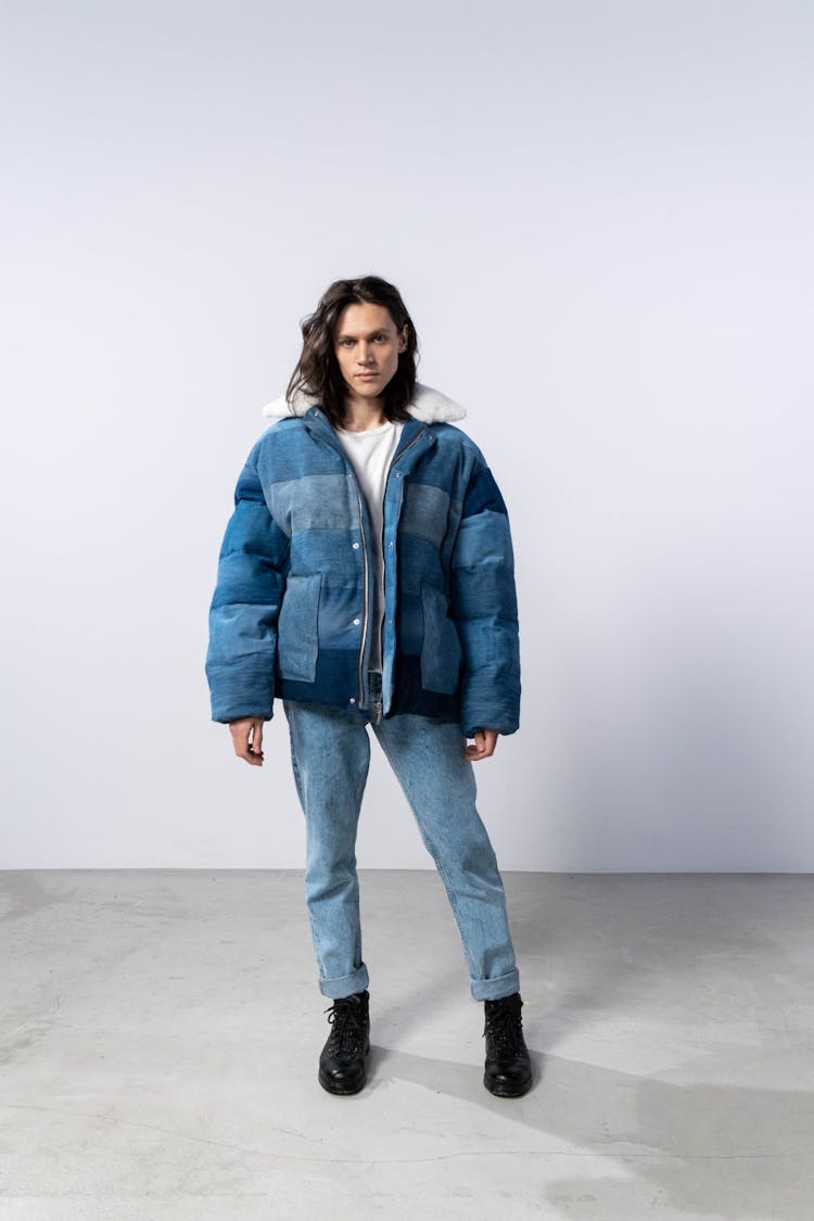 Man With Long Hair In Denim Jacket And Jeans