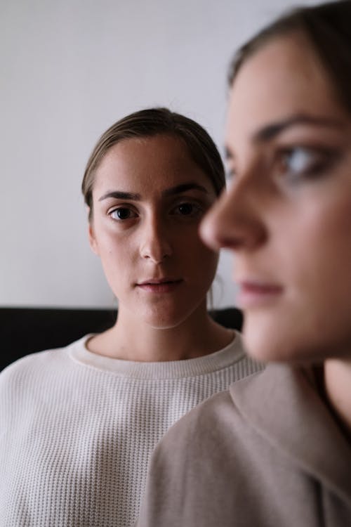 Woman in Beige Top Staring