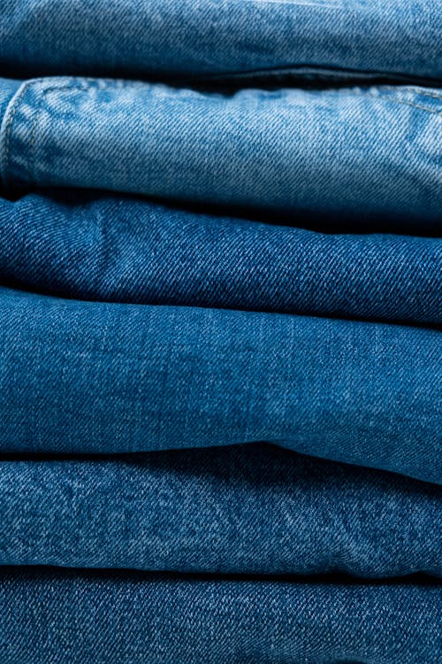 Pile Of Denim Jeans · Free Stock Photo