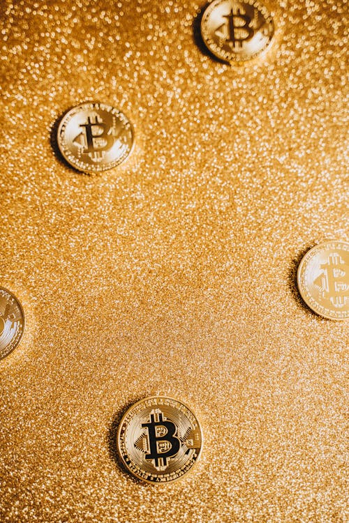 Gold Coins on Glittery Surface 