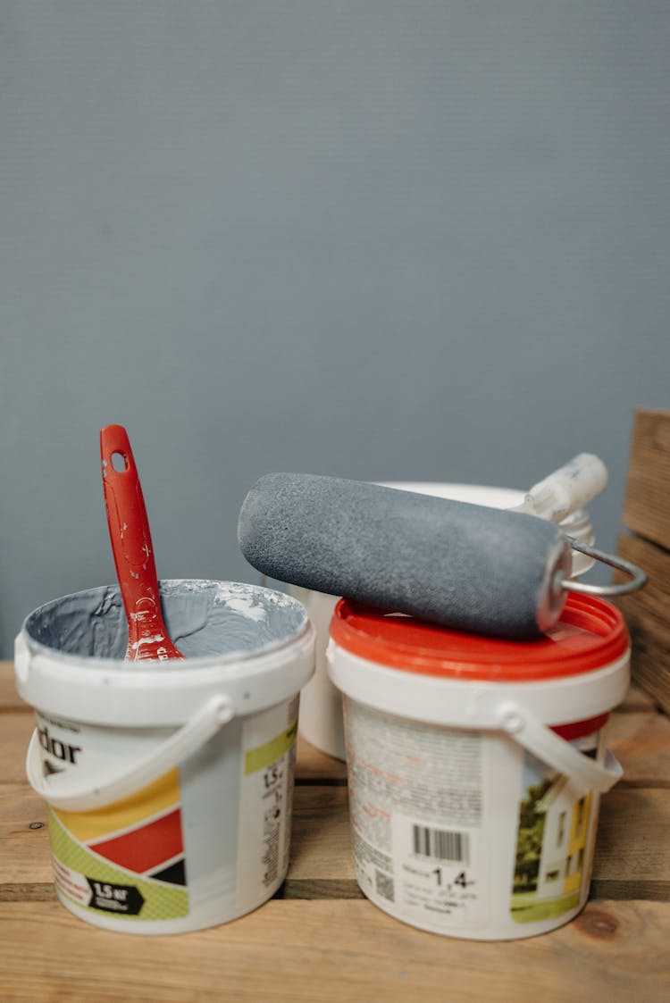 Paintbrushes And Paint Buckets