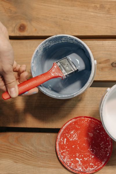 Paint can with paint brush
