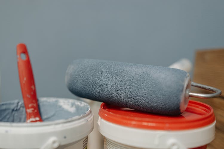 Paint Roller On Top Of A Pail