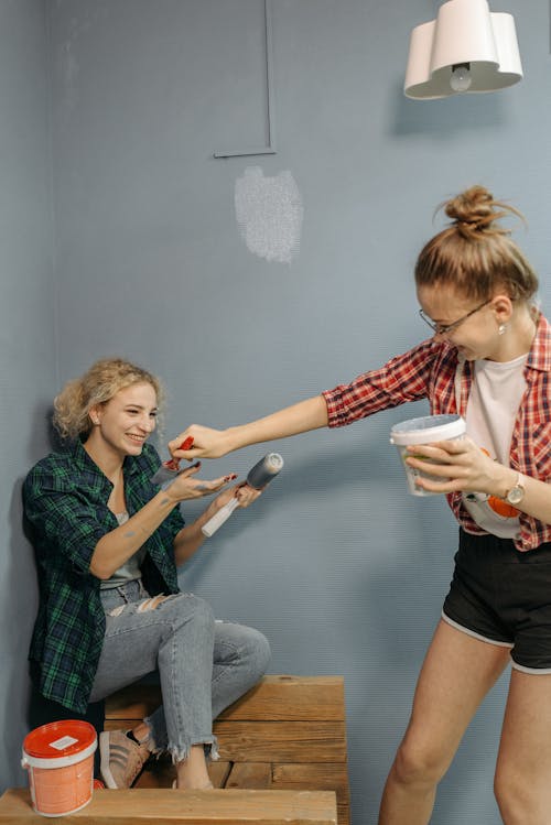 Women Holding Painting Materials