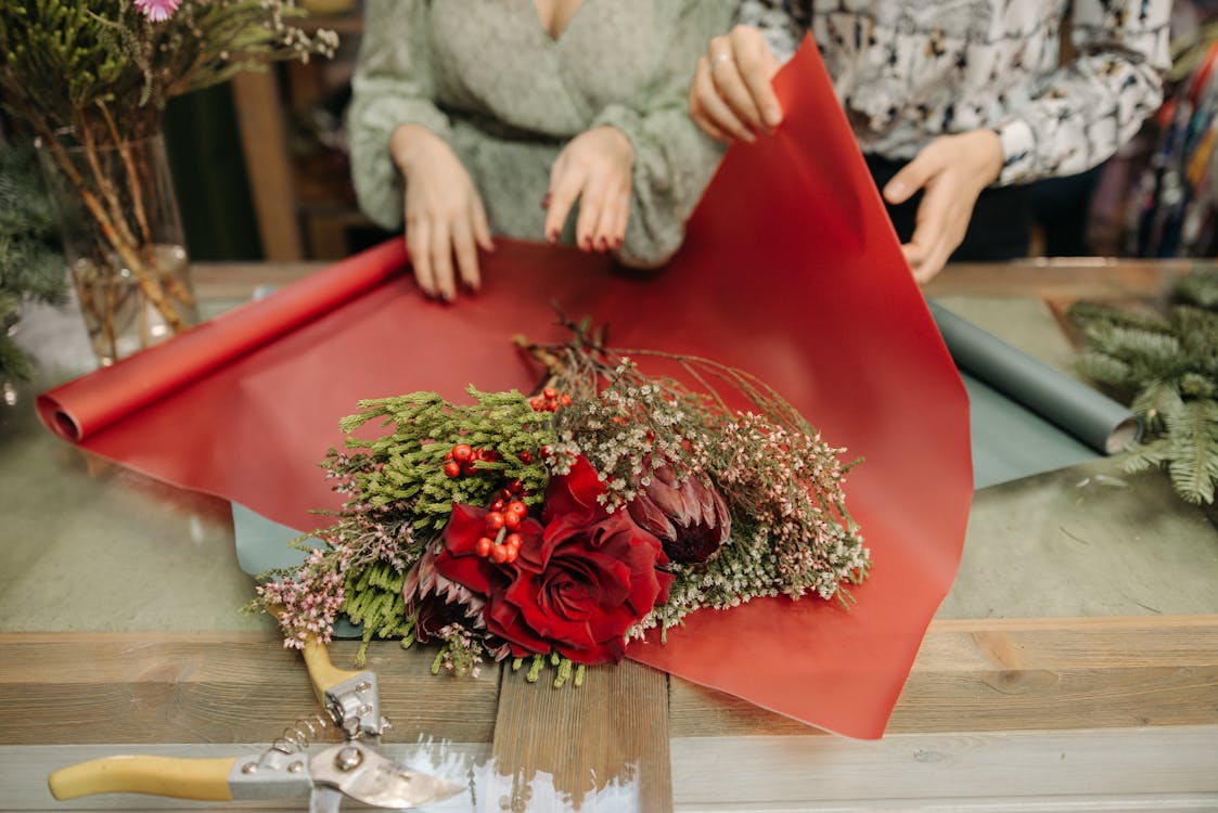 Two People Making a Flower Bouquet