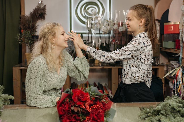 Two Girls In The Flower Shop
