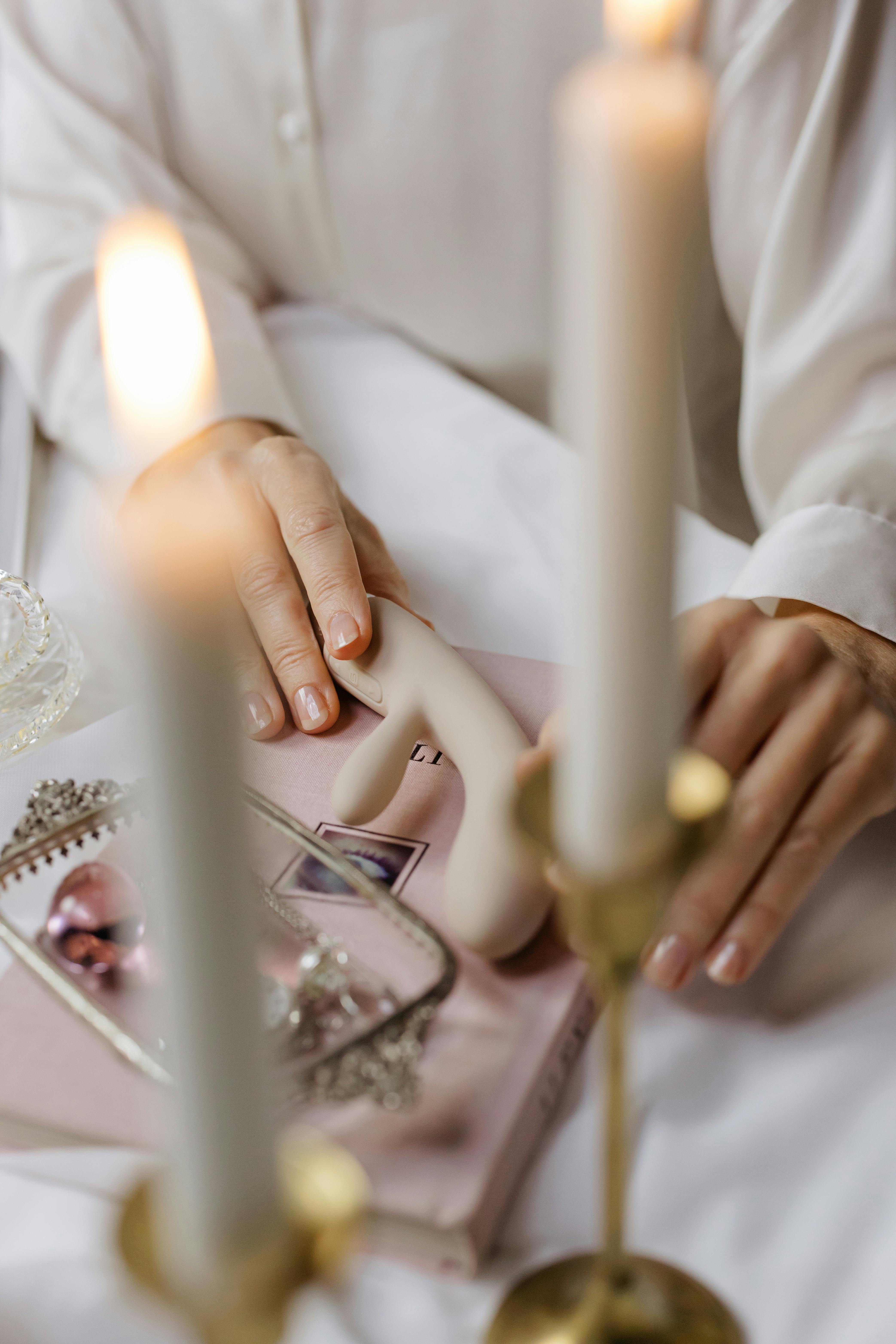 person holding lighted candle stick