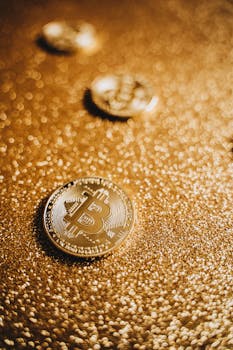 Golden bitcoins on a shimmering golden surface, symbolizing digital wealth.