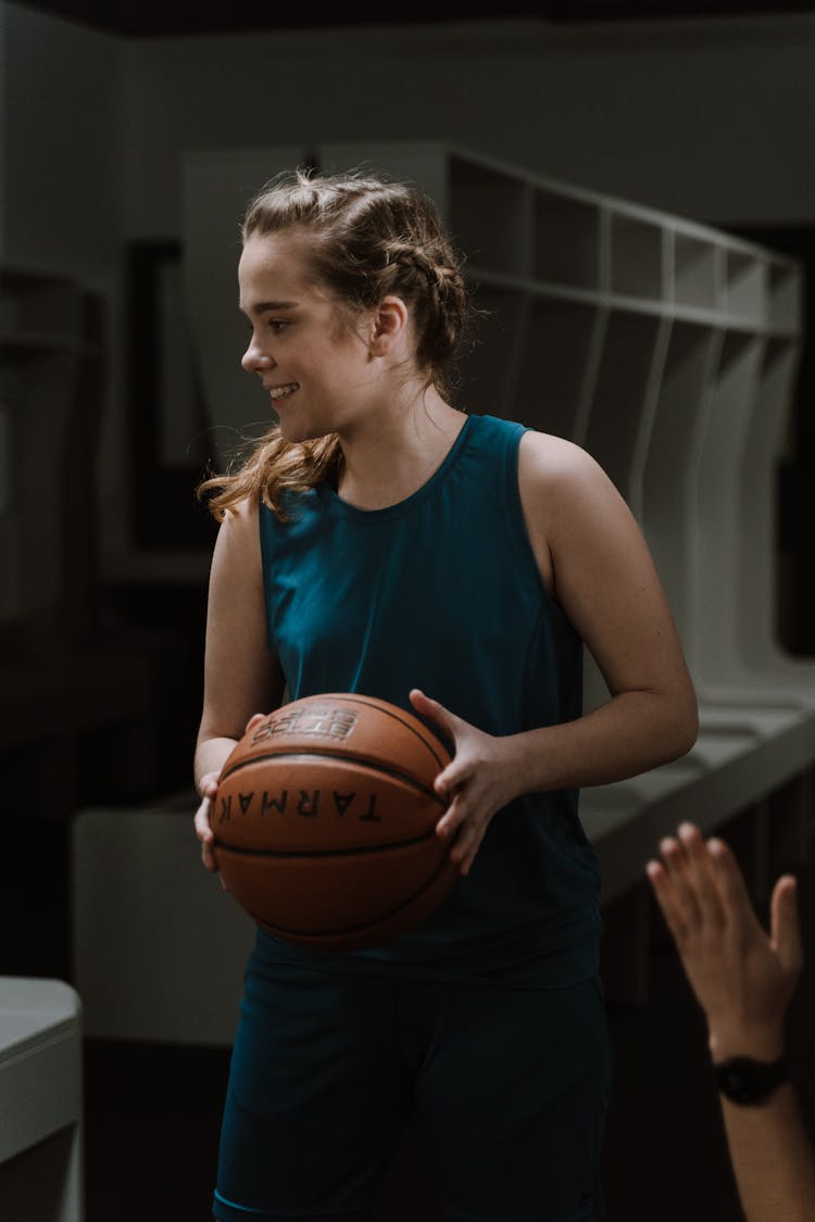 A Woman Holding A Ball