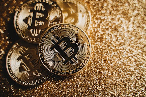 Gratis lagerfoto af bitcoins, guld, guld glitter baggrund