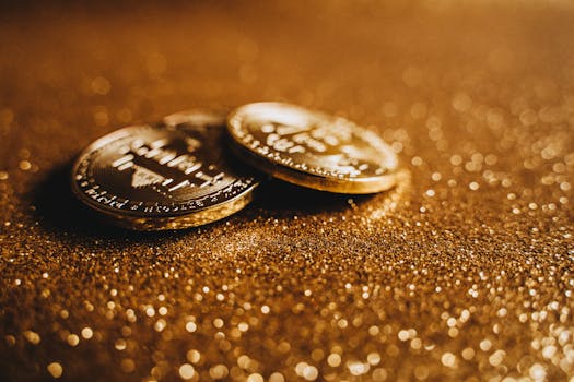 Golden Bitcoin coins on a glittery background symbolizing digital currency wealth.