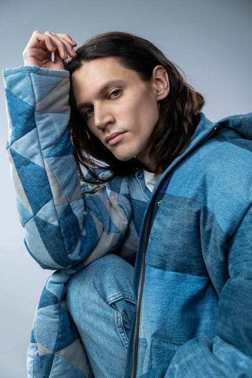 Young Man in a Blue Quilted Jacket