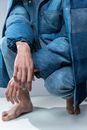 Person in Blue Denim Button Up Shirt and Blue Denim Jeans