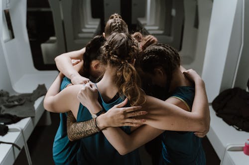 Group pf Women in a Huddle