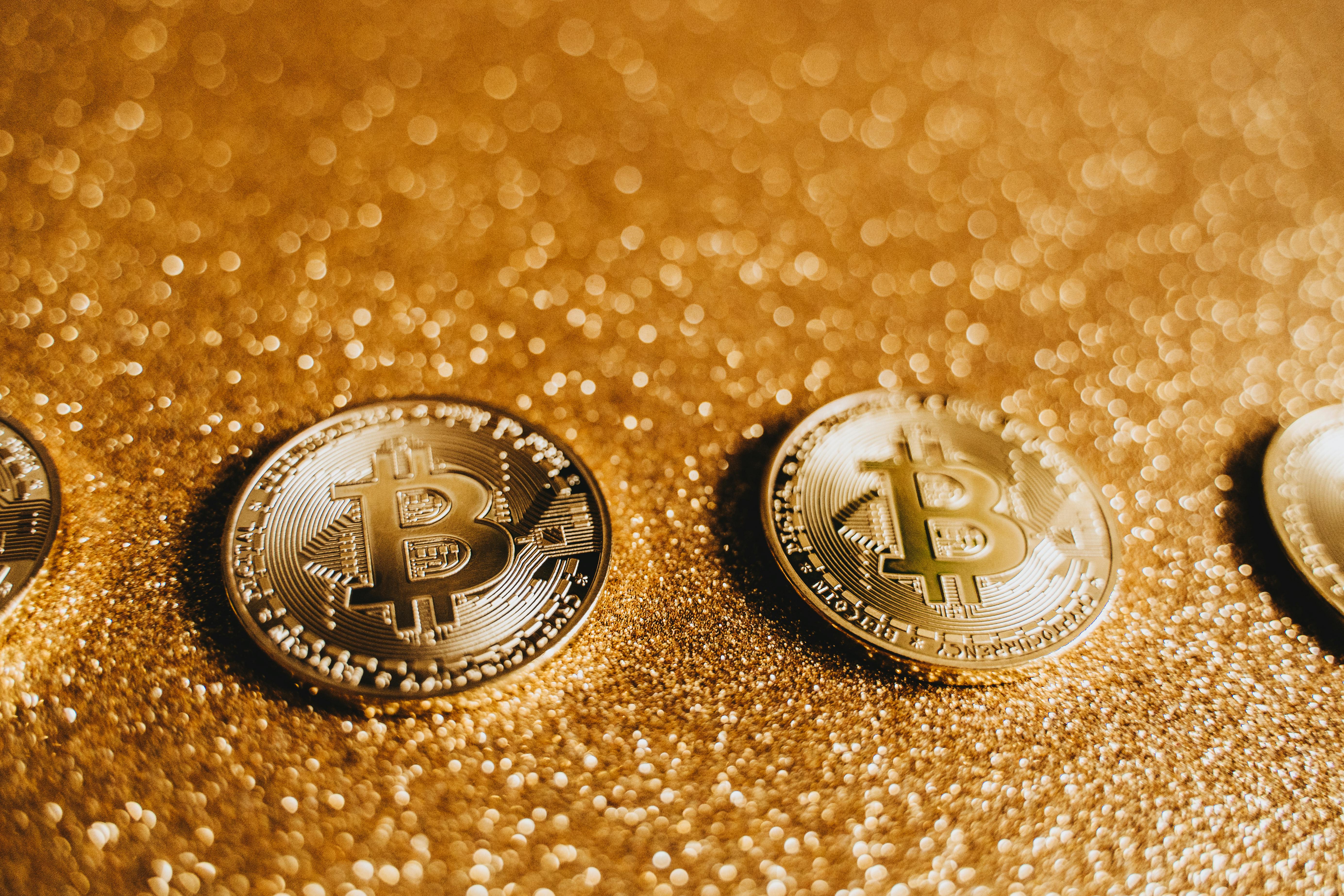 shiny bitcoins with glittery background