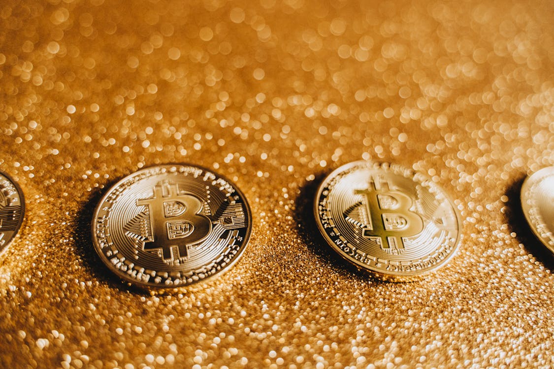 Shiny Bitcoins with Glittery Background