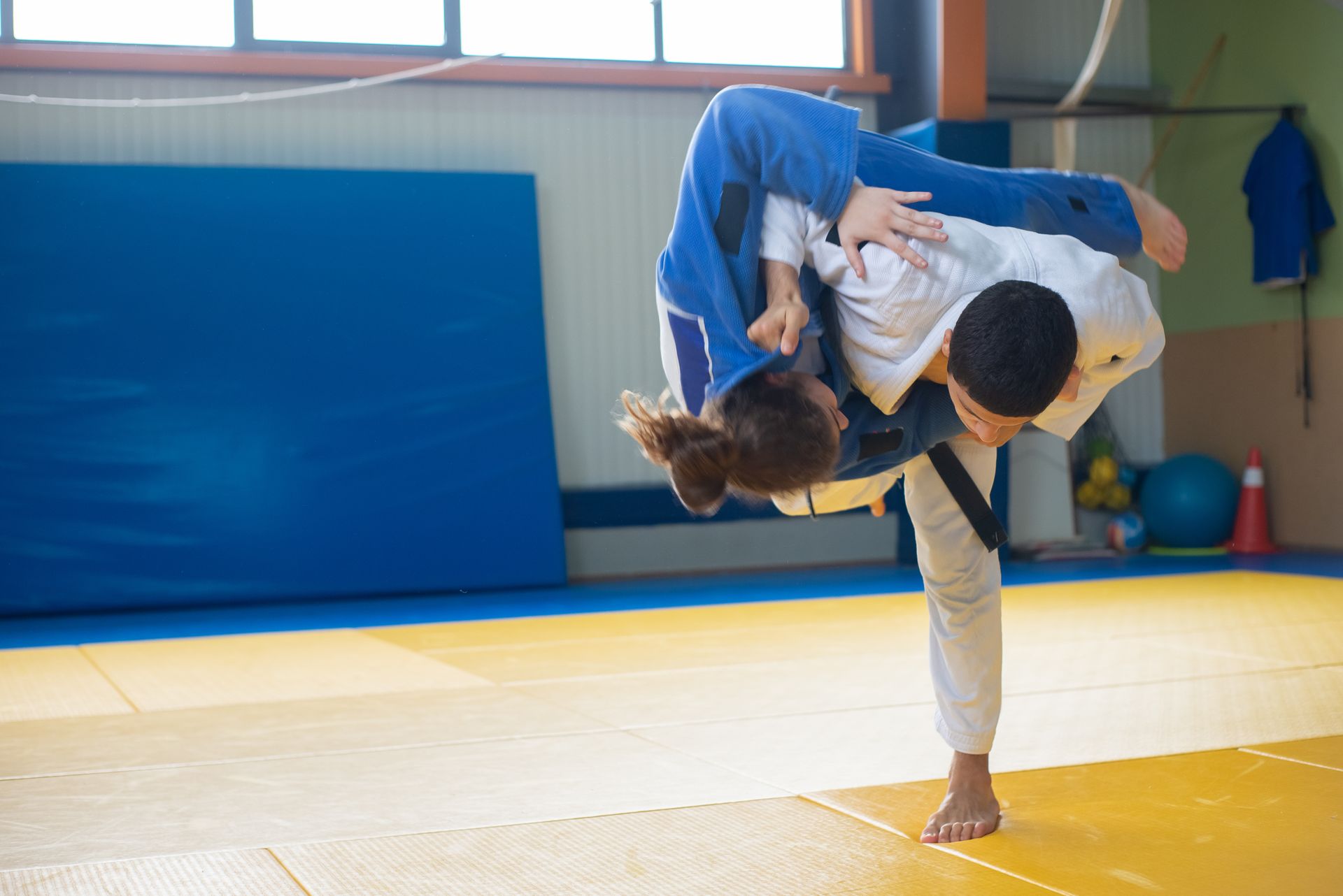 A Judoka Throwing an Opponent to the Ground